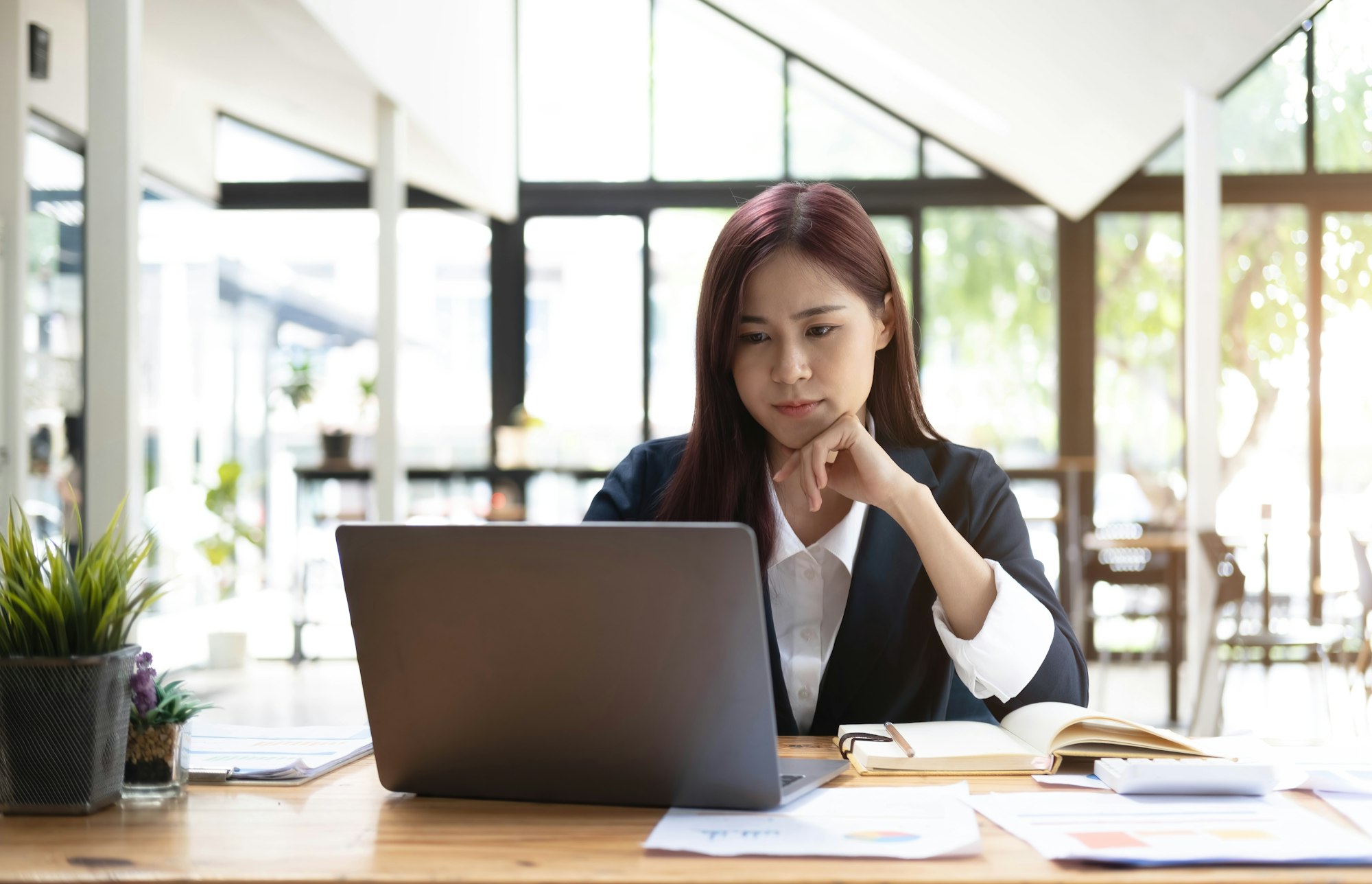 Asian woman working laptop. Business woman busy working on laptop computer at office.